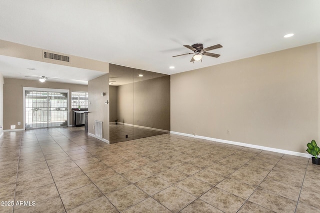 2645 W Elm St, Phoenix, AZ 85017 - tiled empty room featuring ceiling fan, baseboards, and recessed lighting