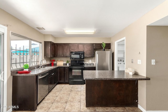 2645 W Elm St, Phoenix, AZ 85017 - kitchen with black appliances, dark countertops, dark brown cabinets, a sink, and a peninsula