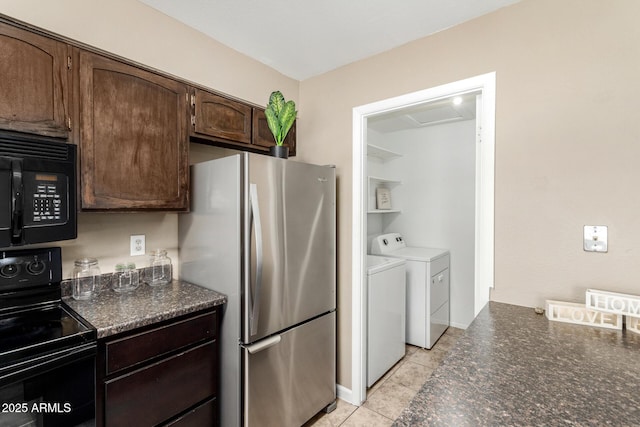 2645 W Elm St, Phoenix, AZ 85017 - kitchen with black appliances, washing machine and clothes dryer, dark brown cabinetry, and dark stone countertops