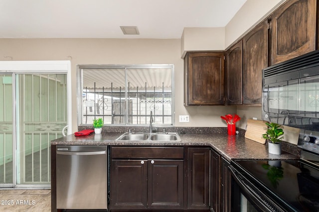 2645 W Elm St, Phoenix, AZ 85017 - kitchen with black appliances, a sink, dark countertops, and dark brown cabinets