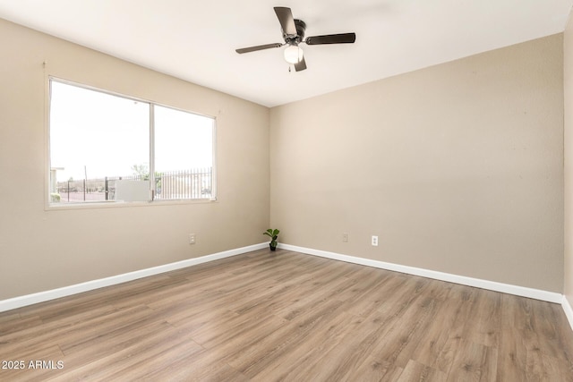 2645 W Elm St, Phoenix, AZ 85017 - spare room with baseboards, light wood-style flooring, and a ceiling fan