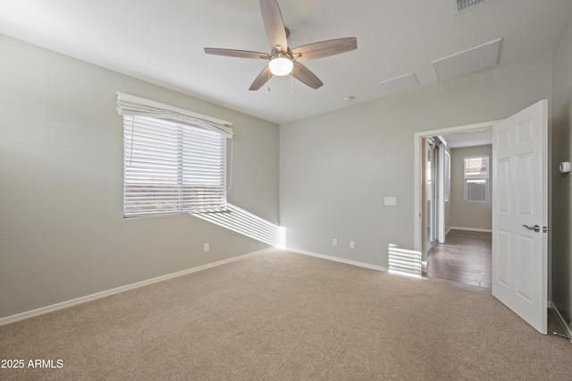 carpeted empty room with ceiling fan