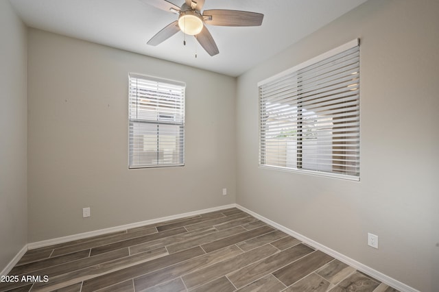 spare room with ceiling fan