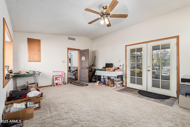 miscellaneous room with french doors, vaulted ceiling, a textured ceiling, carpet flooring, and ceiling fan