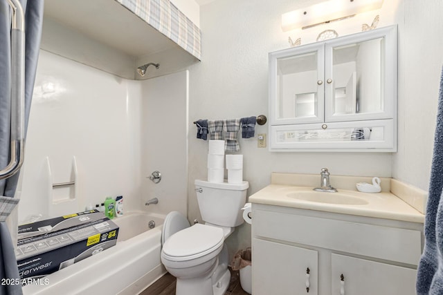 full bathroom with shower / tub combination, vanity, and toilet