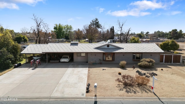 ranch-style house featuring a carport