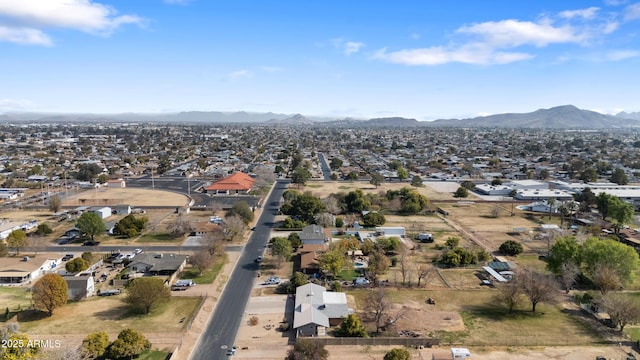 birds eye view of property featuring a mountain view