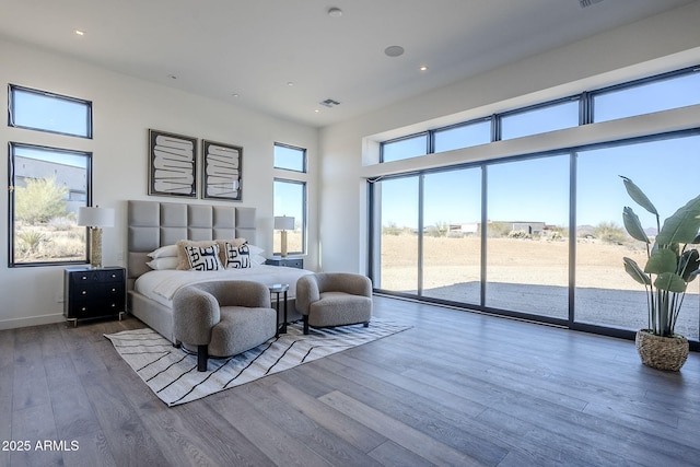 23656 N 123rd St Unit 240, Scottsdale, AZ 85255 - bedroom with baseboards, access to outside, a towering ceiling, visible vents, and wood finished floors