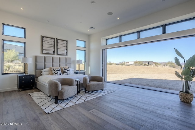 23656 N 123rd St Unit 240, Scottsdale, AZ 85255 - bedroom featuring wood finished floors, access to outside, baseboards, visible vents, and a towering ceiling