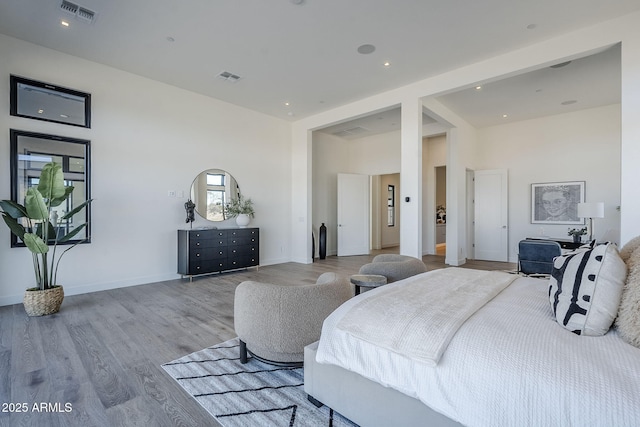 23656 N 123rd St Unit 240, Scottsdale, AZ 85255 - bedroom featuring baseboards, visible vents, wood finished floors, and recessed lighting