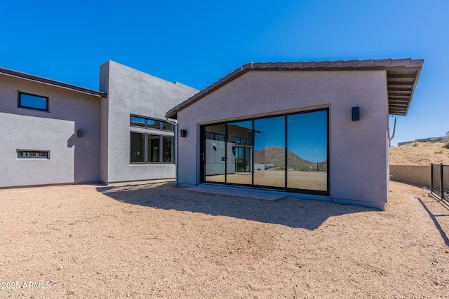23656 N 123rd St Unit 240, Scottsdale, AZ 85255 - rear view of house featuring stucco siding and fence