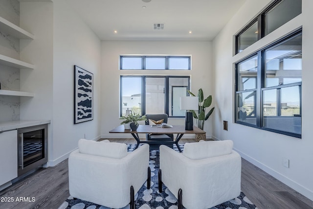 23656 N 123rd St Unit 240, Scottsdale, AZ 85255 - living room featuring built in features, baseboards, dark wood-style floors, and visible vents