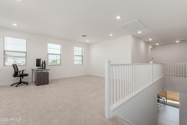 office featuring carpet flooring, recessed lighting, and a wealth of natural light