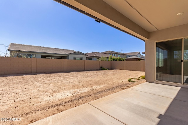 view of yard with a fenced backyard and a patio area