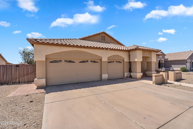 10809 W Harmony Ln, Peoria, AZ 85373 - mediterranean / spanish-style house featuring an attached garage, concrete driveway, stucco siding, and a tiled roof