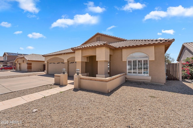 10809 W Harmony Ln, Peoria, AZ 85373 - mediterranean / spanish home with a garage, fence, stucco siding, and driveway