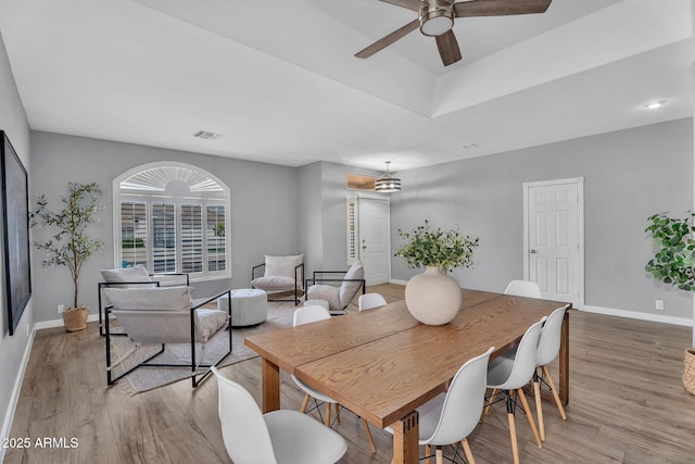 10809 W Harmony Ln, Peoria, AZ 85373 - dining area featuring visible vents, a ceiling fan, light wood-style flooring, and baseboards