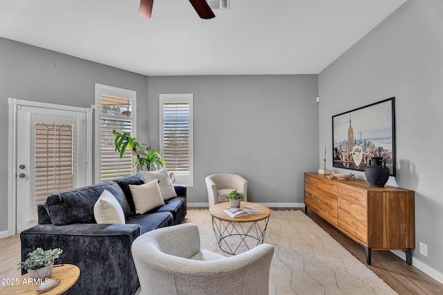 10809 W Harmony Ln, Peoria, AZ 85373 - living area with baseboards, visible vents, wood finished floors, and a ceiling fan