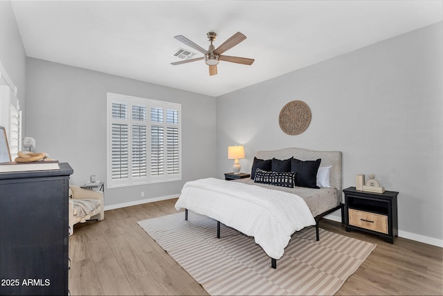 10809 W Harmony Ln, Peoria, AZ 85373 - bedroom with wood finished floors, a ceiling fan, visible vents, and baseboards