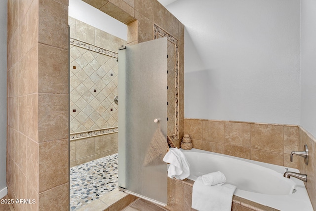 10809 W Harmony Ln, Peoria, AZ 85373 - bathroom featuring a garden tub and tiled shower