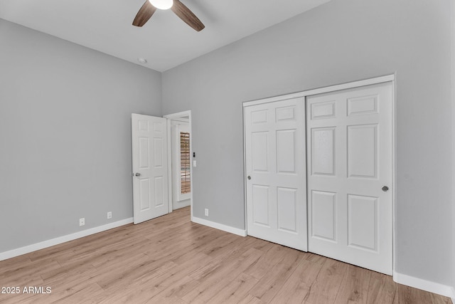 10809 W Harmony Ln, Peoria, AZ 85373 - unfurnished bedroom featuring ceiling fan, a closet, light wood-style flooring, and baseboards