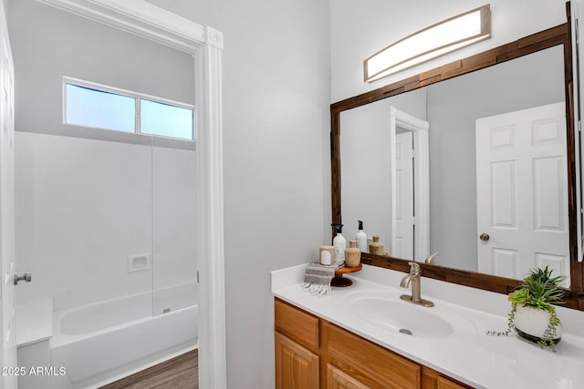 10809 W Harmony Ln, Peoria, AZ 85373 - bathroom featuring shower / bathtub combination, wood finished floors, and vanity
