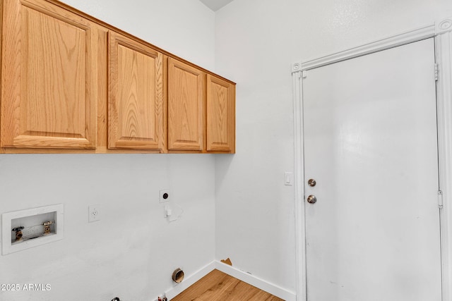 10809 W Harmony Ln, Peoria, AZ 85373 - washroom featuring hookup for an electric dryer, hookup for a gas dryer, hookup for a washing machine, light wood-type flooring, and cabinet space
