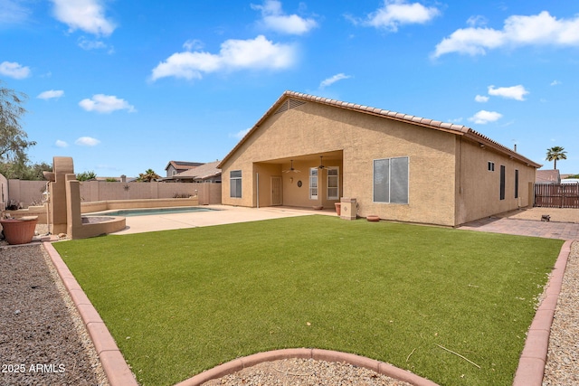 10809 W Harmony Ln, Peoria, AZ 85373 - rear view of property featuring a tile roof, stucco siding, a fenced backyard, and a patio area