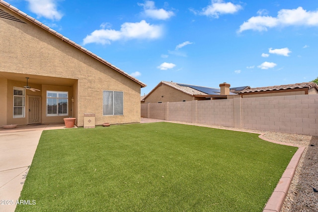 10809 W Harmony Ln, Peoria, AZ 85373 - view of yard with a ceiling fan, a patio, and a fenced backyard