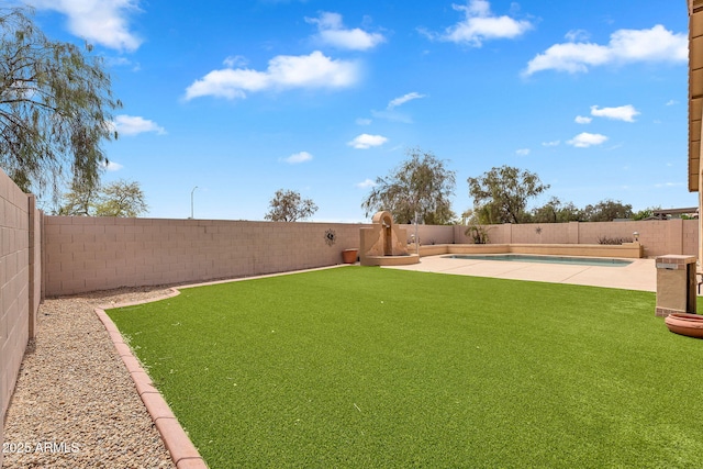 10809 W Harmony Ln, Peoria, AZ 85373 - view of yard featuring a fenced backyard, a fenced in pool, and a patio area