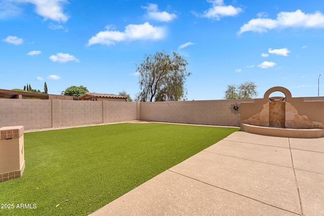 10809 W Harmony Ln, Peoria, AZ 85373 - view of yard featuring a fenced backyard and a patio area
