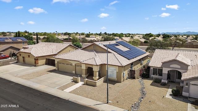 10809 W Harmony Ln, Peoria, AZ 85373 - view of front of property featuring a residential view, concrete driveway, solar panels, and stucco siding