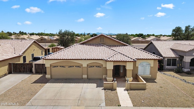 10809 W Harmony Ln, Peoria, AZ 85373 - mediterranean / spanish house with stucco siding, driveway, a tiled roof, an attached garage, and fence