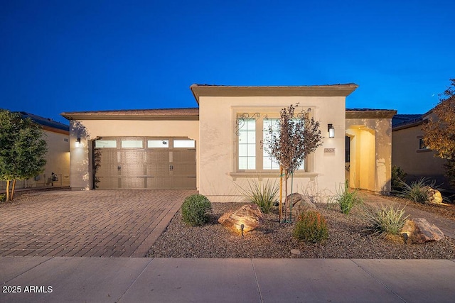 view of front of property with a garage