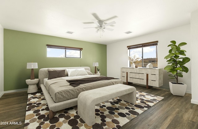 bedroom with ceiling fan and dark wood-type flooring