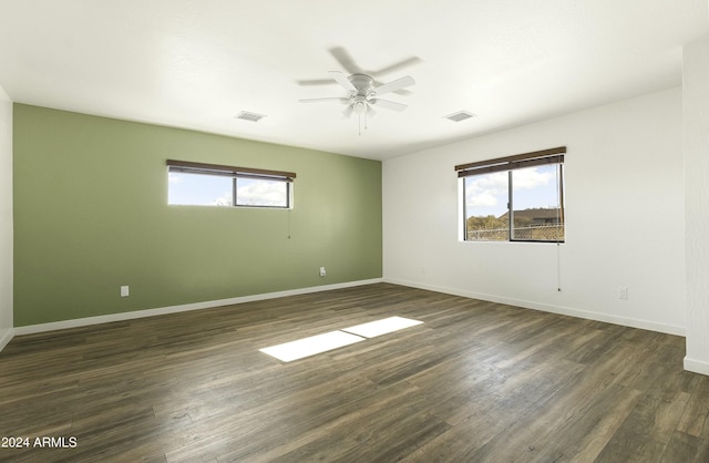 unfurnished room featuring dark hardwood / wood-style floors and ceiling fan