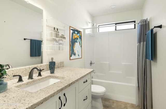 full bathroom with shower / tub combo, vanity, and toilet