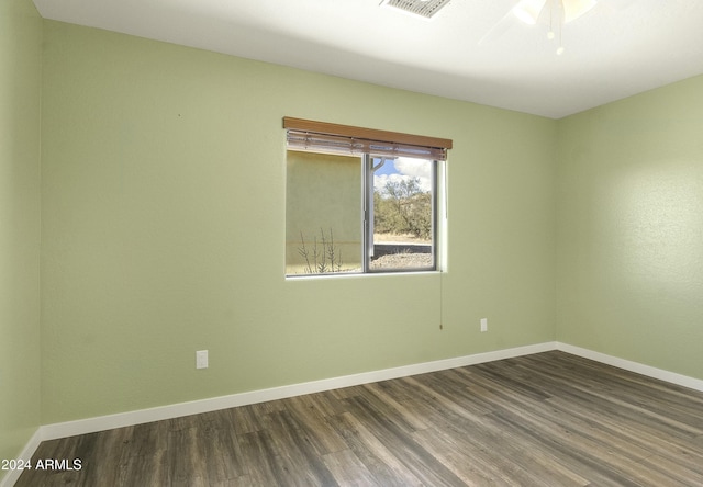 empty room with ceiling fan and hardwood / wood-style floors