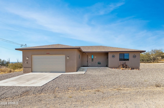 single story home featuring a garage