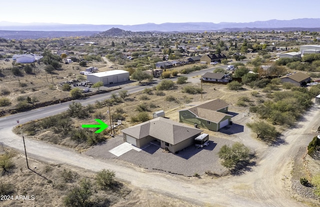 drone / aerial view featuring a mountain view