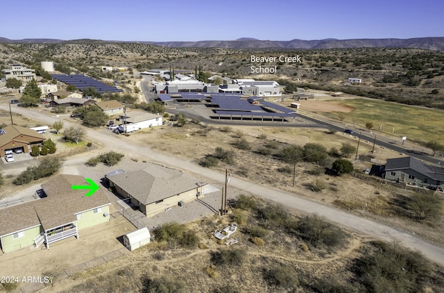 birds eye view of property featuring a mountain view