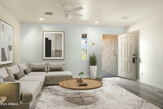 living room featuring ceiling fan and wood-type flooring