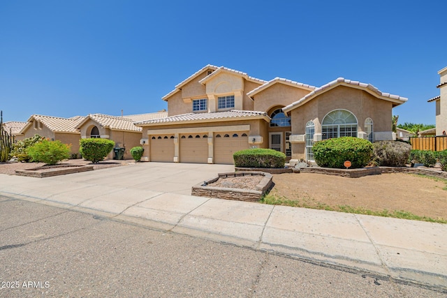 728 W Sandra Ter, Phoenix, AZ 85023 - mediterranean / spanish-style home with stucco siding, a garage, concrete driveway, and a tile roof