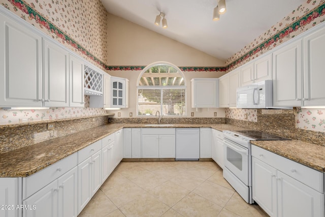 728 W Sandra Ter, Phoenix, AZ 85023 - kitchen featuring white appliances, lofted ceiling, white cabinetry, light tile patterned floors, and glass insert cabinets