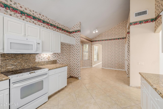 728 W Sandra Ter, Phoenix, AZ 85023 - kitchen featuring white appliances, lofted ceiling, wallpapered walls, white cabinets, and light tile patterned floors