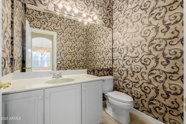 728 W Sandra Ter, Phoenix, AZ 85023 - half bathroom with wallpapered walls, vanity, tile patterned flooring, and a chandelier
