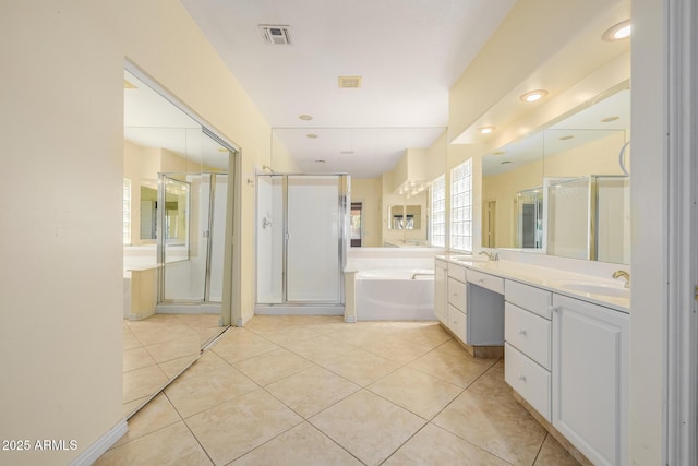 728 W Sandra Ter, Phoenix, AZ 85023 - full bathroom with a garden tub, a stall shower, double vanity, and tile patterned floors