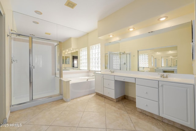728 W Sandra Ter, Phoenix, AZ 85023 - full bath featuring a bath, double vanity, a shower stall, and tile patterned floors