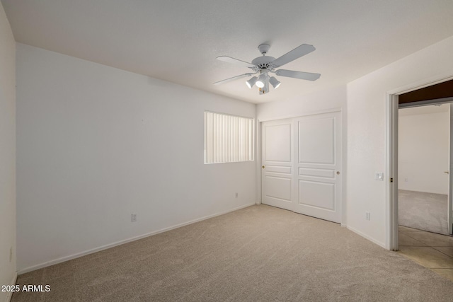 728 W Sandra Ter, Phoenix, AZ 85023 - unfurnished bedroom with light colored carpet, a closet, and a ceiling fan