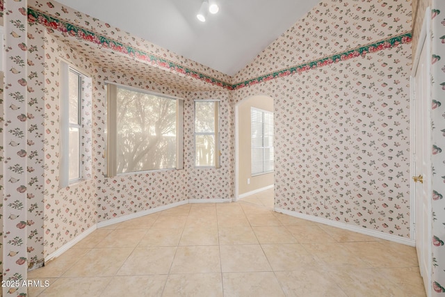 728 W Sandra Ter, Phoenix, AZ 85023 - tiled spare room with lofted ceiling and wallpapered walls